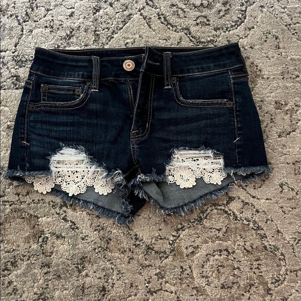 Jean shorts. Brand is American eagle. Doily detailing. Size 00. Super stretch.